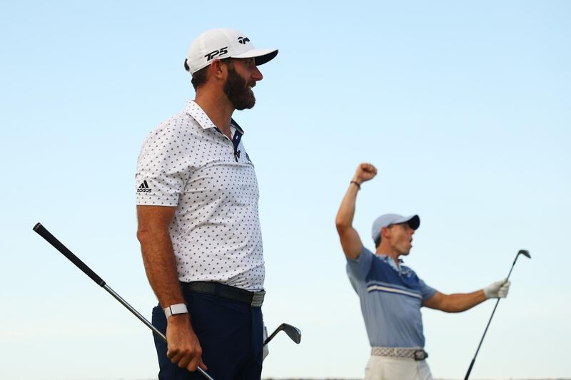 Rory McIlroy and Dustin Johnson of the American Nurses Foundation team on the 17th tee after winning the closest to the pin playoff against Rickie Fowler and Matthew Wolff of the CDC Foundation team during the TaylorMade Driving Relieve Supported By UnitedHealth Group in Juno Beach, Florida. AFP