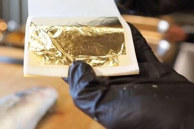 Edible gold leaf is used to coat the fish