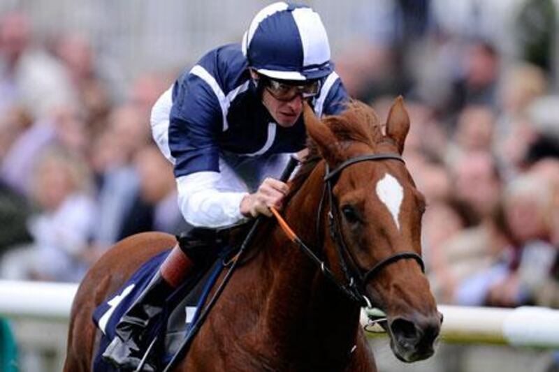 Richard Hughes riding Strong Suit to the win in the Burj Khalifa Challenge Stakes at Newmarket.