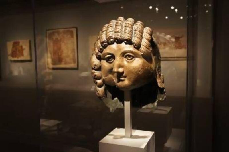 A bronze head from the first or second century BC found at Qaryat Al-Faw, part of the Roads of Arabia exhibit. Tish Wells / MCT via Getty Images