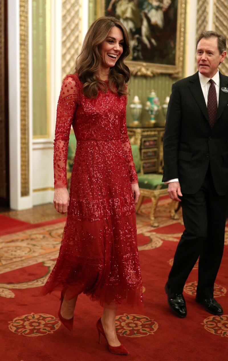 Catherine, Duchess of Cambridge walks through to the State Room with the Master of the Household at a reception at Buckingham Palace to mark the UK-Africa Investment Summit, in London, Britain January 20, 2020. Yui Mok/Pool via REUTERS