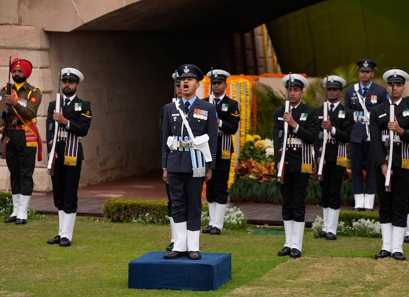 Indian soldiers pay their respects to Gandhi in New Delhi.  AP