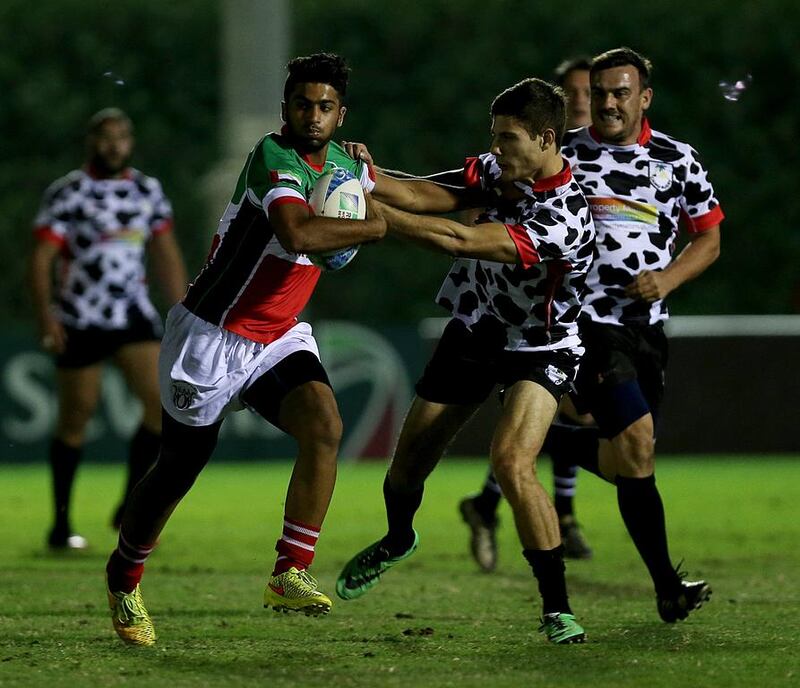 The UAE 7s team, in green, lost to Cairo during the Rugby Sevens Series at the Rugby Sevens grounds in Dubai on December 4, 2014. Satish Kumar / The National
