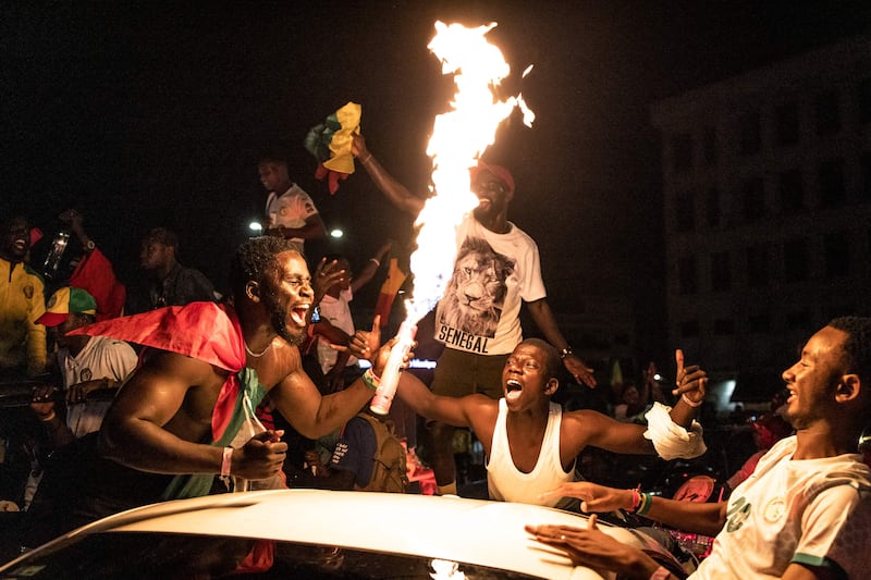 Senegal football supporters celebrate in Dakar. AFP