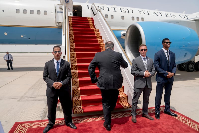 Mr Pompeo boards his plane at Abu Dhabi International Airport. AP Photo