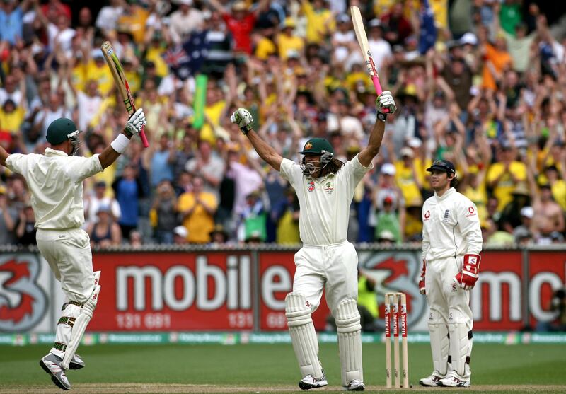Andrew Symonds celebrates reaching his century with teammate Matthew Hayden during a Test between Australia and England. PA
