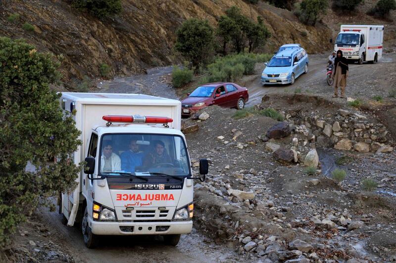 Ambulances and cars transport the injured to hospital. EPA