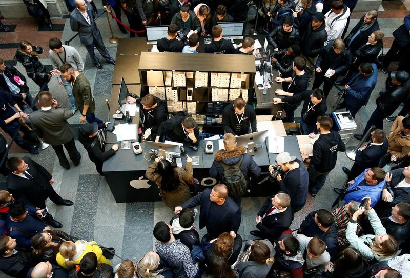 Customers check out the launch of the new iPhone 7 at the State Department Store, GUM, in central Moscow, Russia, on September 23, 2016. Sergei Karpukhin / Reuters