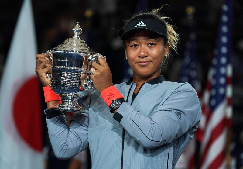 US Open Women's Single champion Naomi Osaka of Japan hold the trophy following her Women's Singles Finals match against Serena Williams of the US at the 2018 US Open at the USTA Billie Jean King National Tennis Center in New York on September 8, 2018. (Photo by TIMOTHY A. CLARY / AFP)