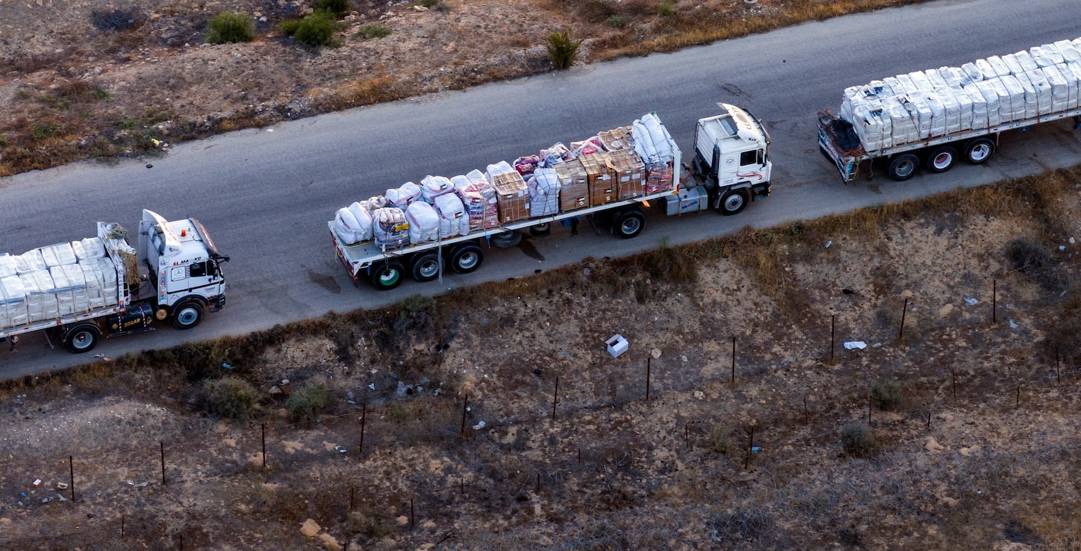 A drone picture of part of a line of trucks waiting on an Egyptian road along the border with Israel, near the Rafah border crossing with the Gaza Strip May 2, 2024. REUTERS/Oren Alon