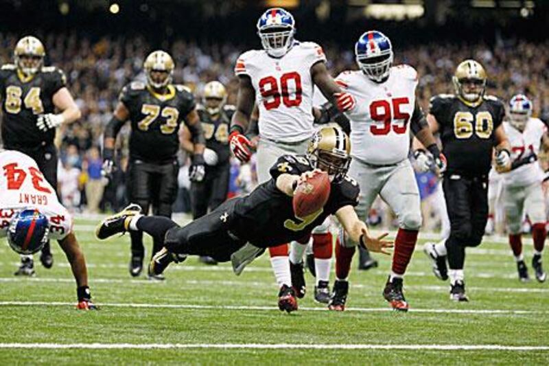 New Orleans Saints quarterback Drew Brees dives for a touchdown against the New York Giants.