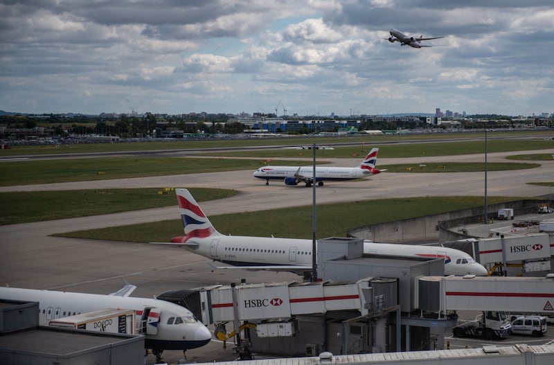 British Airways is among the airlines urged by British authorities to take steps to avoid more flight cancellations. Bloomberg