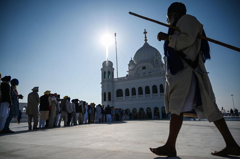 Sikh Pilgrims stand in a queue to visit the Shrine of Baba Guru Nanak Dev at Gurdwara Darbar Sahib in Kartarpur, near the Indian border. Hundreds of Indian Sikhs prepared to make a historic pilgrimage to Pakistan on November 9 crossing to one of their religion's holiest sites under a landmark deal between the two countries separated by the 1947 partition of the subcontinent. AFP