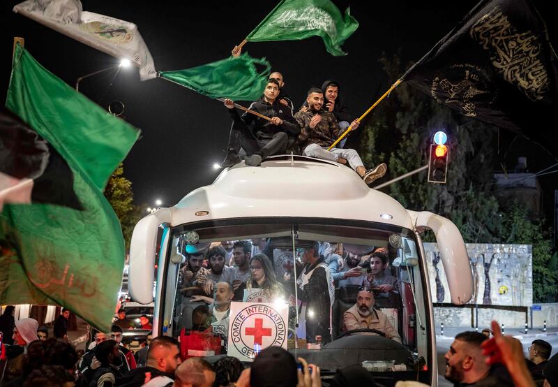 A Red Cross bus carries Palestinians detainees released from Israeli jails in exchange for hostages released by Hamas, in Ramallah in the occupied West Bank. AFP