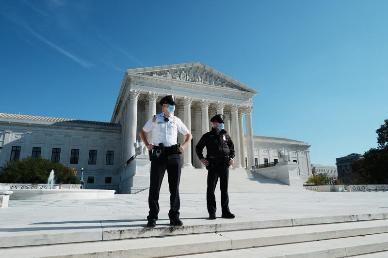 Two police officer looks on as Trump supporters gather in front of the Supreme Court, in Washington, DC, USA. US President Donald J. Trump has refused to concede the 2020 Presidential election to his Democratic challenger President-Elect Joe Biden.  EPA
