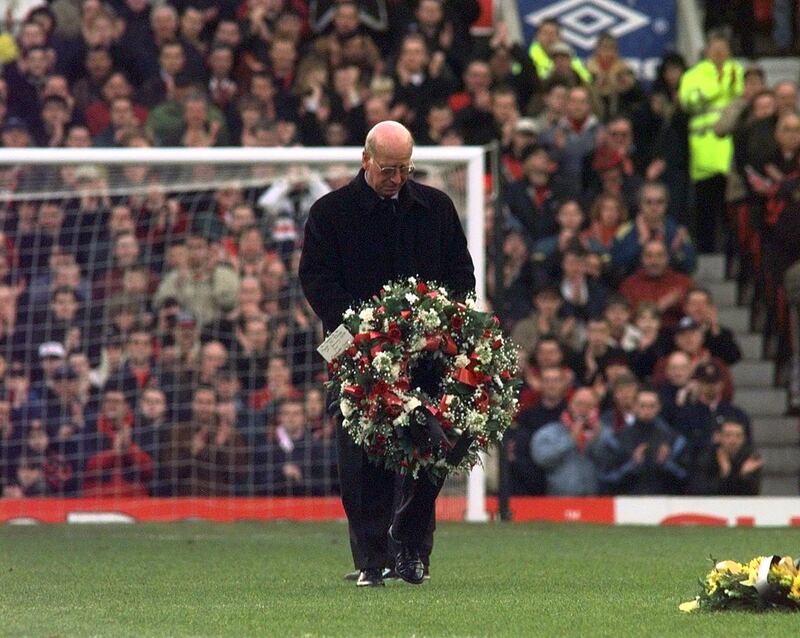 Sir Bobby Charlton, in 1998, lays a wreath to mark the 40th anniversary of the Munich Air crash. PA