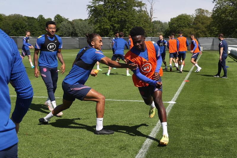 MIDDLESBROUGH, ENGLAND - JUNE 04: Jesse Lingard, Dominic Calvert-Lewin and Bukayo Saka of England compete in a game of tag during the England training session on June 04, 2021 in Middlesbrough, England. (Photo by Eddie Keogh - The FA/The FA via Getty Images)