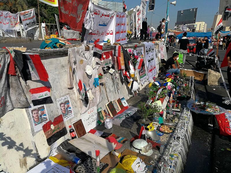 Posters of protesters who have been killed in demonstrations, their belongings, and protesters' slogans are displayed in Tahrir Square during ongoing anti-government protests in Baghdad, Iraq. AP Photo