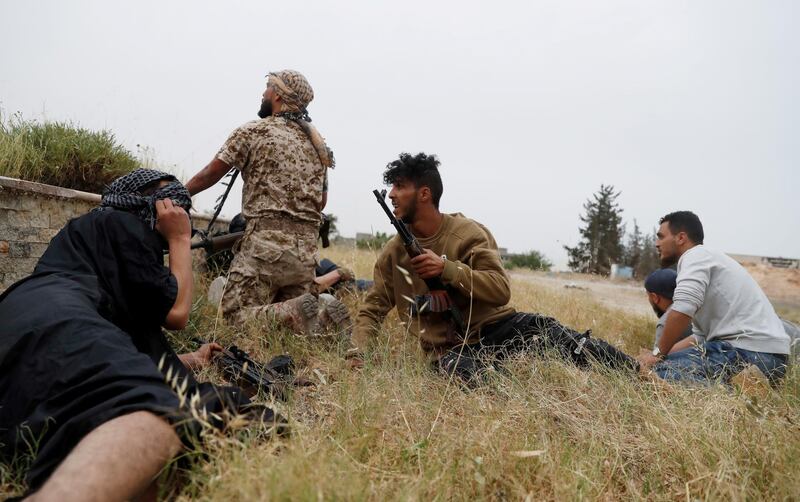 GNA fighters take cover. Reuters
