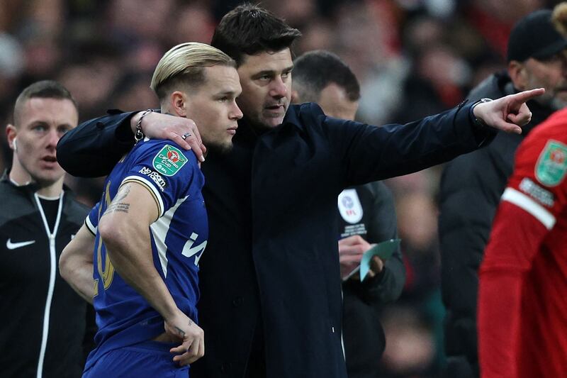 Chelsea manager Mauricio Pochettino gives instructions to substitute Mykhailo Mudryk during the League Cup final against Liverpool on Sunday. AFP