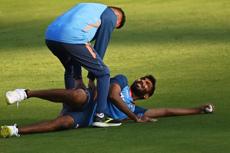 India's Jasprit Bumrah stretches during training. AFP