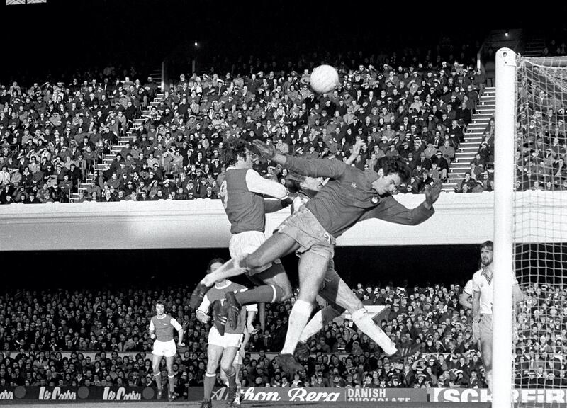Arsenal striker Malcolm Macdonald (left) and West Ham goalkeeper Mervyn Day jump for a high ball in the London "derby" First Division Match at Highbury.   (Photo by PA Images via Getty Images)