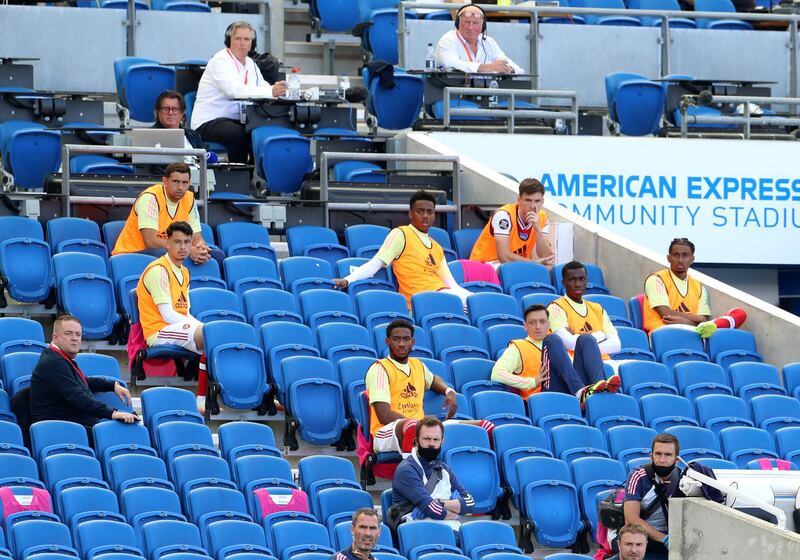 Arsenal subs at the American Express Community Stadium. Getty