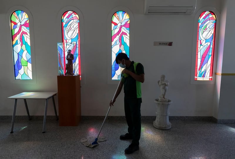 Dubai, United Arab Emirates - Reporter: Kelly Clark: A gentleman cleans at St. Francis of Assisi Catholic Church. Churches suspend mass gatherings and increase cleaning operations. Thursday, March 12th, 2020. Jebel Ali, Dubai. Chris Whiteoak / The National