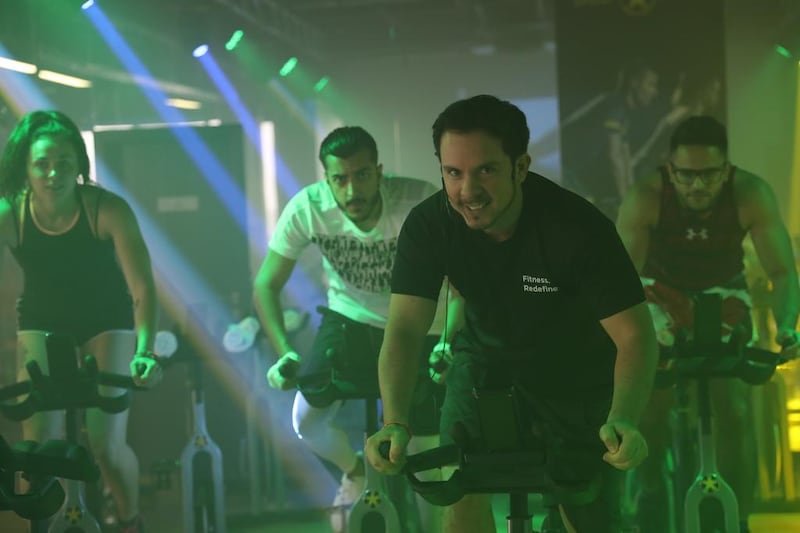 Attend a free glow-in-the-dark spinning class on May 15 at Fit Inc indoor cycling studio in Dubai. Courtesy Fit Inc