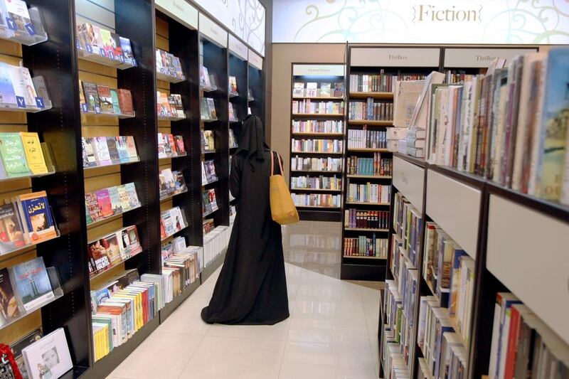 A customer looks through the books at Magrudy's in Al Wahda Mall in Abu Dhabi. Sammy Dallal / The National