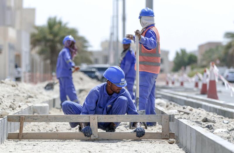 Abu Dhabi, United Arab Emirates, July 15, 2019.  Standalone weather images.  Road workers protect  themselves with scarfs from the heat while doing roadworks at Khalifa City.
Victor Besa/The National
Section:  NA
Reporter: