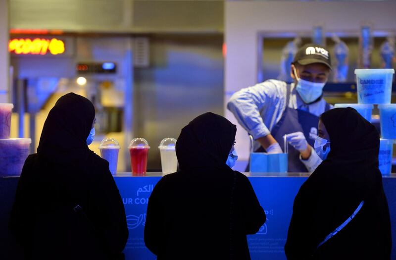 Saudi women buy food before watching a movie at a cinema in Riyadh. AFP