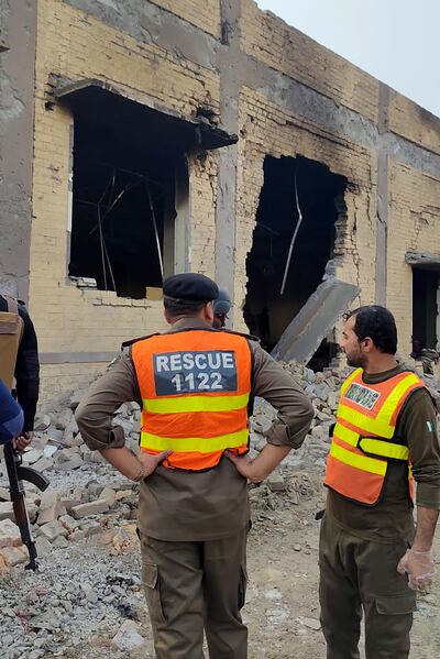 Rescuers search for survivors after militants rammed an explosive-laden vehicle into a military base, in Dera Ismail Khan. AFP