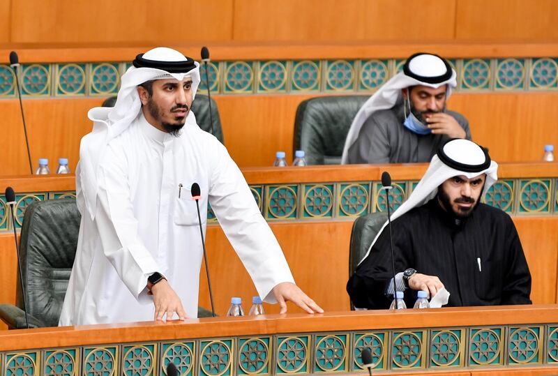 Member of Parliament Bader Al Dahoum, left, speaks at a special National Assembly session in Kuwait City. EPA