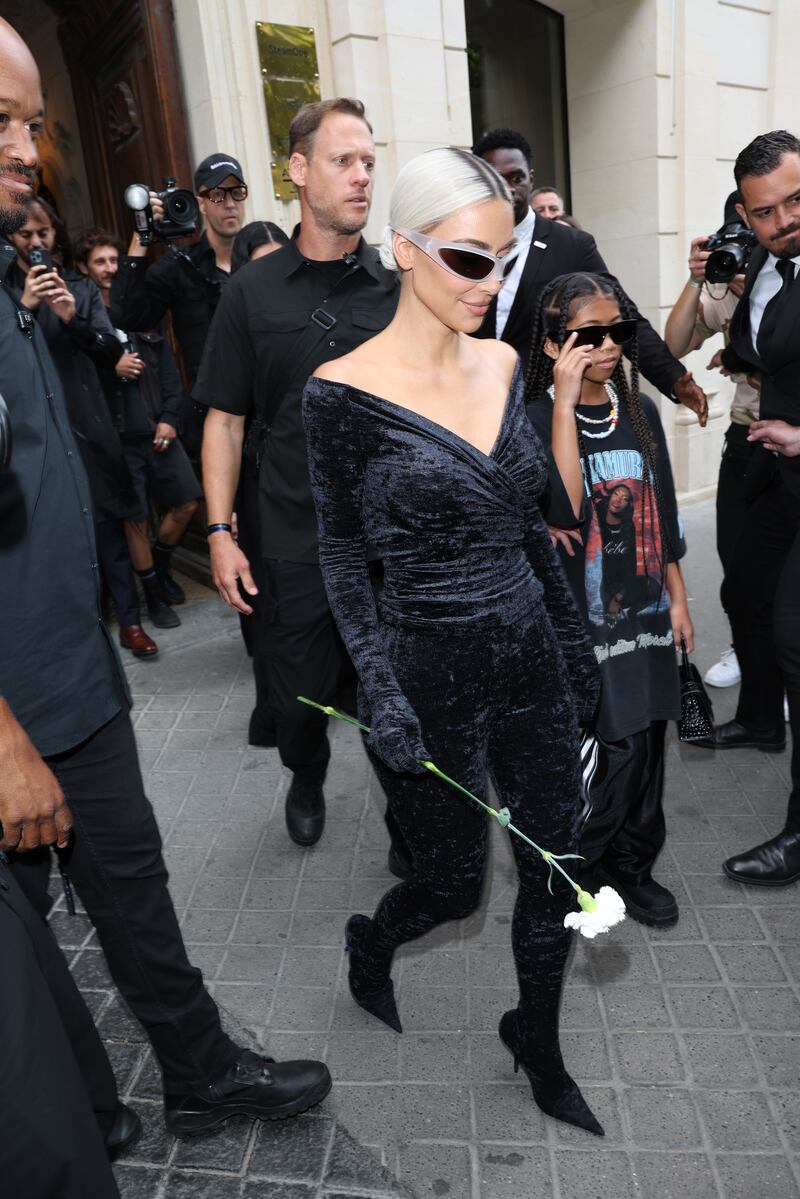 Kim Kardashian and Saint West depart the Balenciaga show in Paris. Getty Images