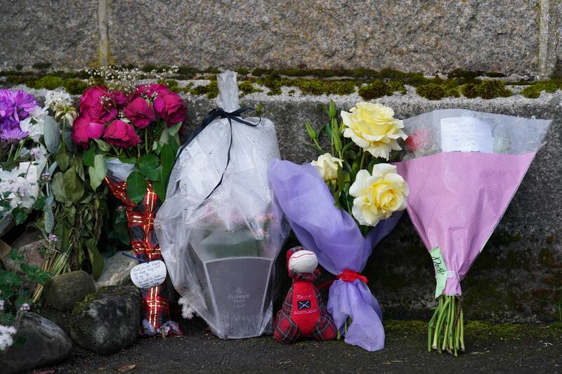 Floral tributes left outside the gates of Balmoral Castle. PA