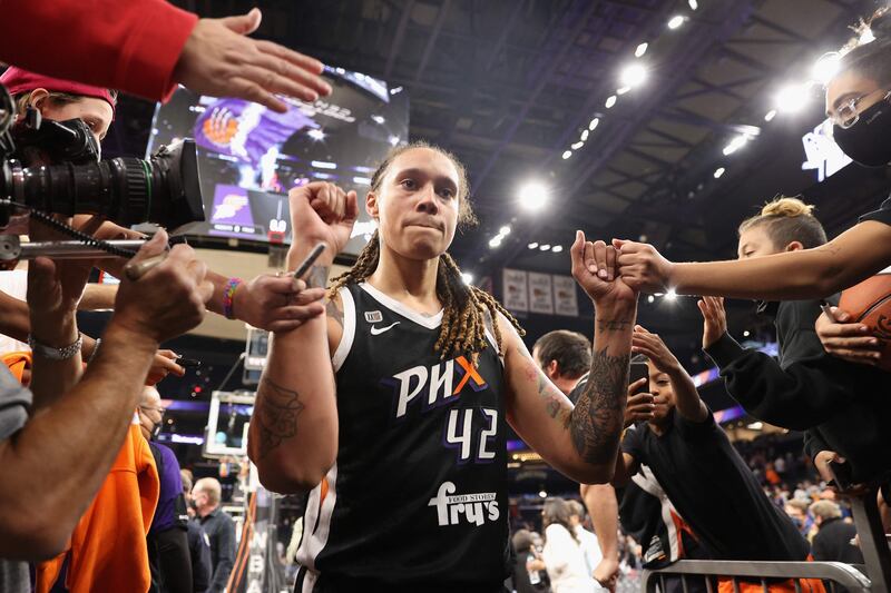 Brittney Griner of the Phoenix Mercury celebrates with fans. Getty Images North America / AFP