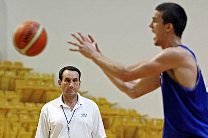 Duke University’s basketball coach Mike Krzyzewski watches Marshall Plumlee during practice at the Al Wasl Club in Dubai last night. Duke take on the UAE in a friendly tonight.