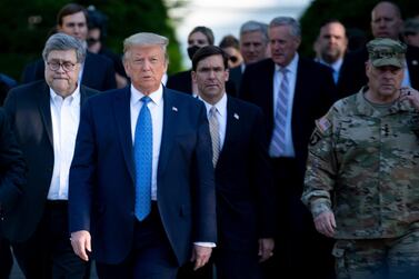 US President Donald Trump walks with Attorney General William Barr, left, Secretary of Defence Mark Esper, centre, and Chairman of the Joint Chiefs of Staff Mark Milley, among others, from the White House to St John's Church in Washington earlier in the month. AFP