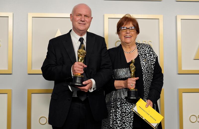 Best Production Design: Donald Graham Burt and Jan Pascale, for 'Mank',  pose in the press room at the Oscars on Sunday, April 25, 2021, at Union Station in Los Angeles. AP Photo