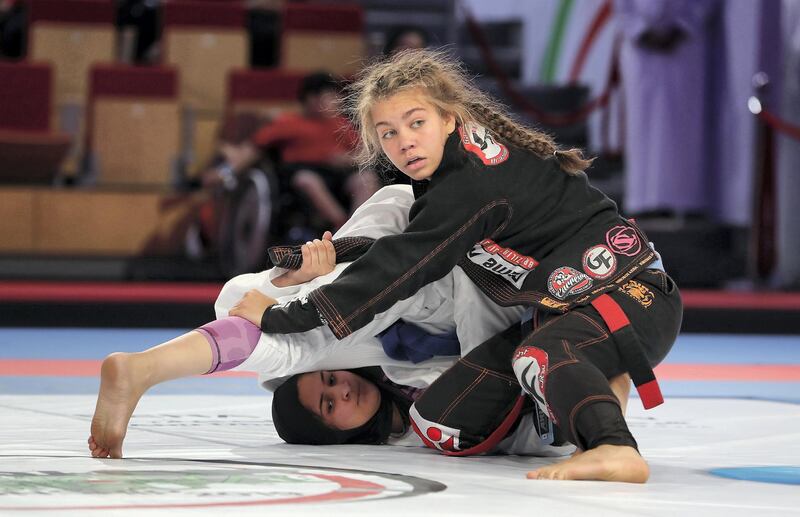 ABU DHABI,  UNITED ARAB EMIRATES , April 21 – 2019 :- Aylla Silva ( red from Al Wahda Club Jiu Jitsu Academy ) vs Asma Hasan Ali Hasan Al Hosani ( blue from Al Dhafra Jiu Jitsu Club ) during the final of 57kg category in the Abu Dhabi World Professional Jiu Jitsu  Championship 2019 held at the Mubadala Arena in Abu Dhabi. Aylla red won the fight. ( Pawan Singh / The National ) For Sports. Story by Amith