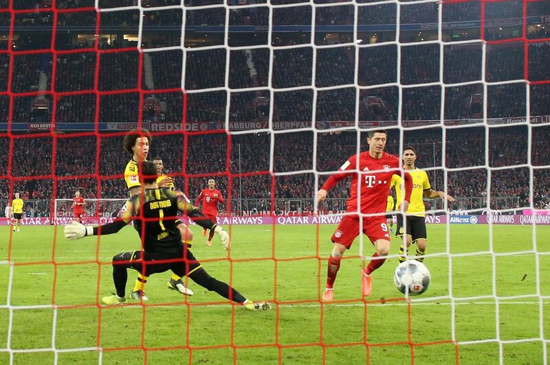 Robert Lewandowski scores his second and Bayern's third goal against Dortmund. Getty Images