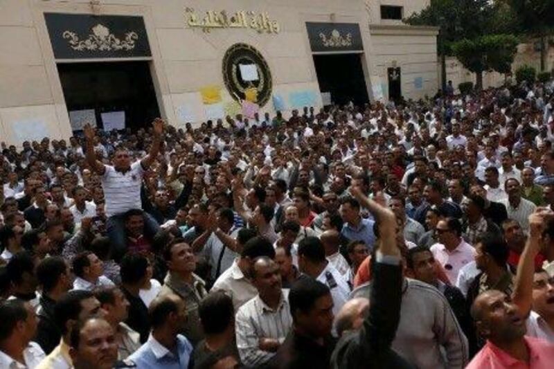 Police officers protest in Cairo last October during a nationwide strike for better salaries and a purge of former regime officials.