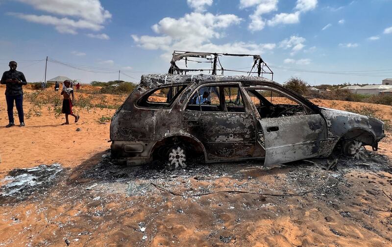 The wreckage of a car is seen burnt following an overnight attack in Mogadishu, Somalia, February 16, 2022. Reuters