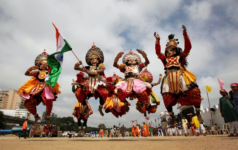 Indian students dressed in traditional attire leap in the air while taking part in Independence Day celebrations in Bangalore, India, Monday, Aug. 15, 2011. India marked 64 years of independence from British rule. (AP Photo) INDIA OUT *** Local Caption ***  India Independence Day.JPEG-01342.jpg