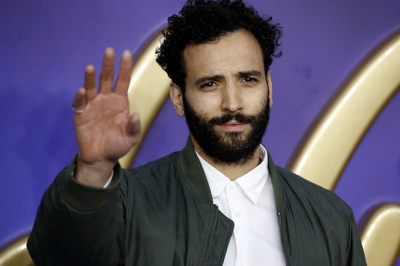 Dutch actor Marwan Kenzari poses on arrival for the European Gala of Aladdin in central London on May 9, 2019. (Photo by Tolga AKMEN / AFP)