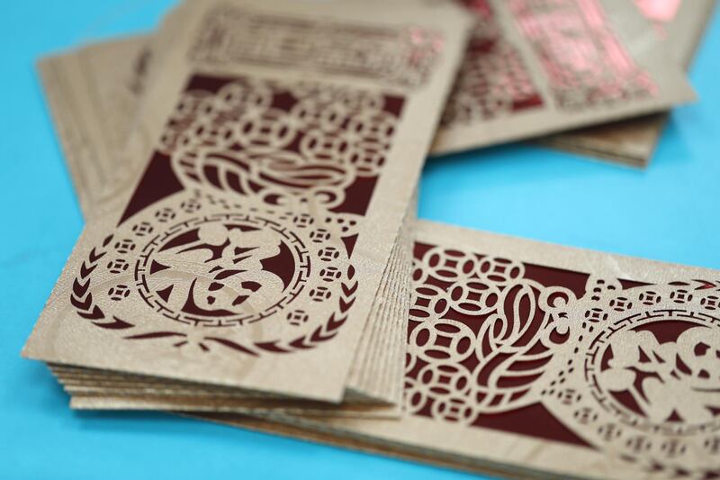 Envelopes used for giving out lucky money, known as "Lai See" in Cantonese and "Hong Bao" in Mandarin, are arranged for a photograph at the Yau Kee Printing Group facility in Hong Kong, China. Bloomberg