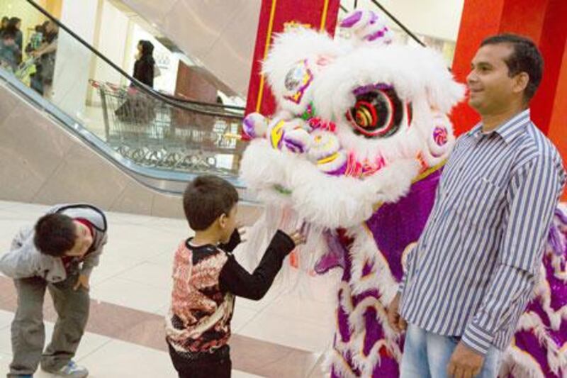 Dragon dancers to celebrate the start of the Chinese new year. Dragon Mart, Dubai. Duncan Chard for the National.