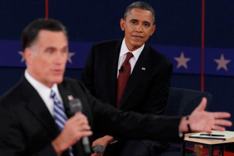 US President Barack Obama listens as Republican presidential nominee Mitt Romney answers a question during the second presidential debate. Reuters / Lucas Jackson