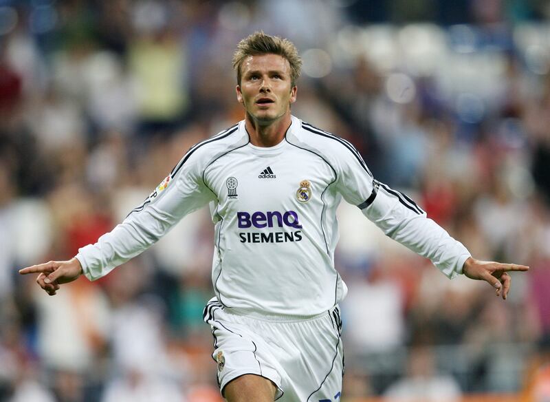 (FILES) Picture taken on September 17, 2006 shows Real Madrid's David Beckham celebrating after scoring against Real Sociedad at the Santiago Bernabeu Stadium in Madrid. David Beckham is to retire from professional football at the end of the season, his representative announced on May 16, 2013.
  AFP PHOTO/PHILIPPE DESMAZES
 *** Local Caption ***  129042-01-08.jpg